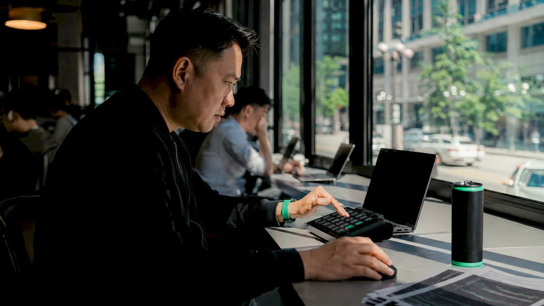 Trader using external trading keypad at desk