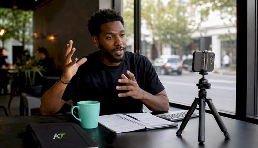 Trader recording short-form video at home desk