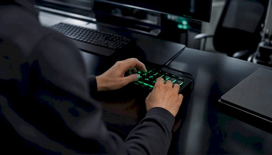 Close-up of hands on trading keypad