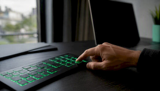 Trader hand pressing key on trading keypad