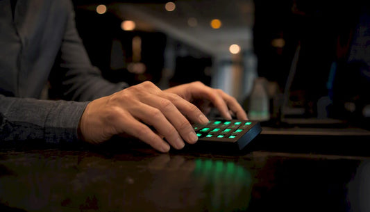 Hands pressing keys on trading keypad