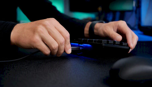 Hands connecting trading keypad cables