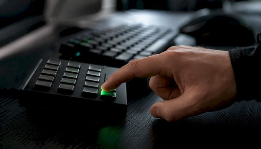 Trader hand pressing keypad key