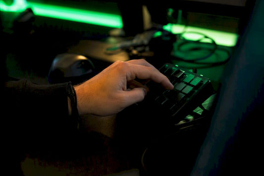 Hand pressing key on trading keypad