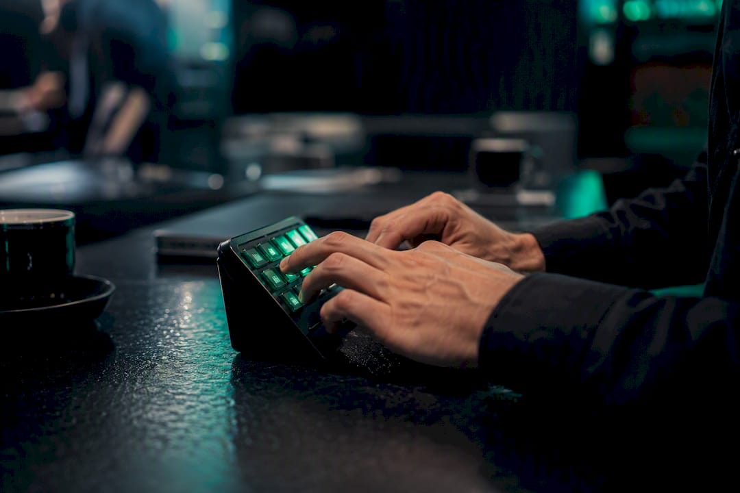 Trader hands operating trading keypad