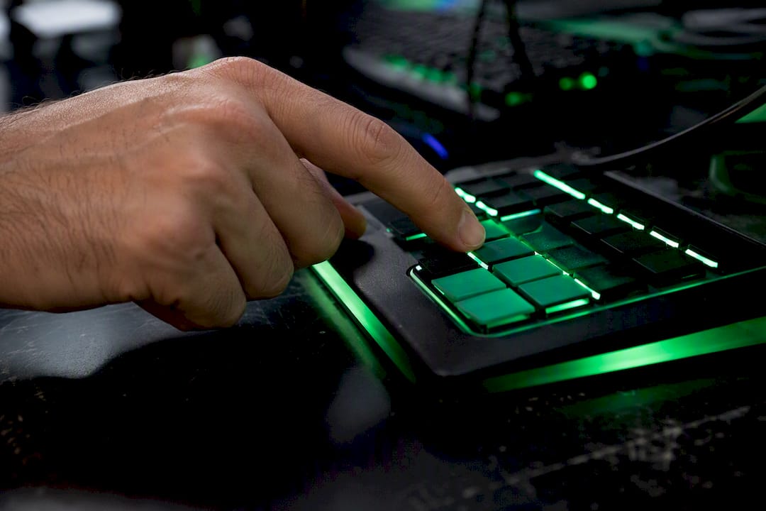 Trader hand pressing keypad button close-up