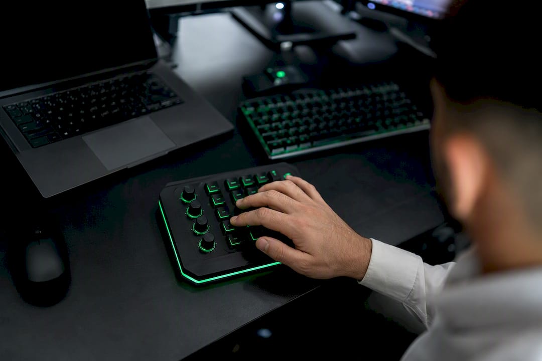 Hand pressing keys on trading keypad close-up