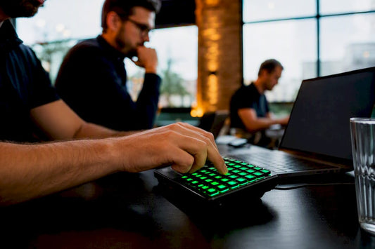 Hand pressing keys on trading keypad