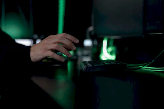 Trader hand pausing after pressing keypad