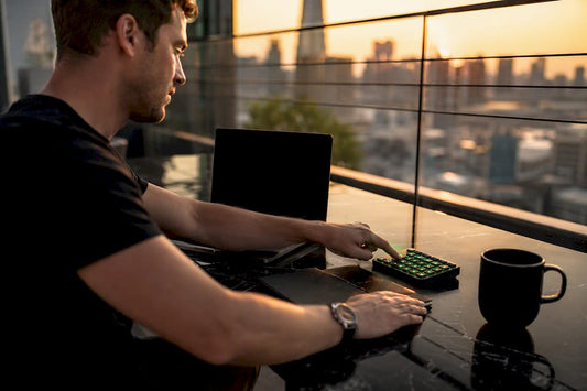 Trader hand pressing trading keypad button