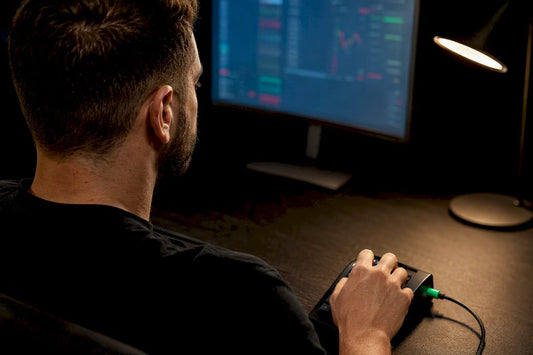 Trader configuring keypad at prop desk