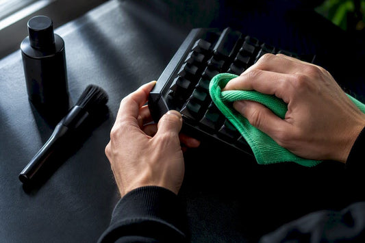 Hands cleaning a disconnected trading keypad