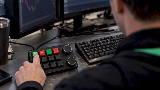 Trader using a Key-Trade keypad at a trading desk