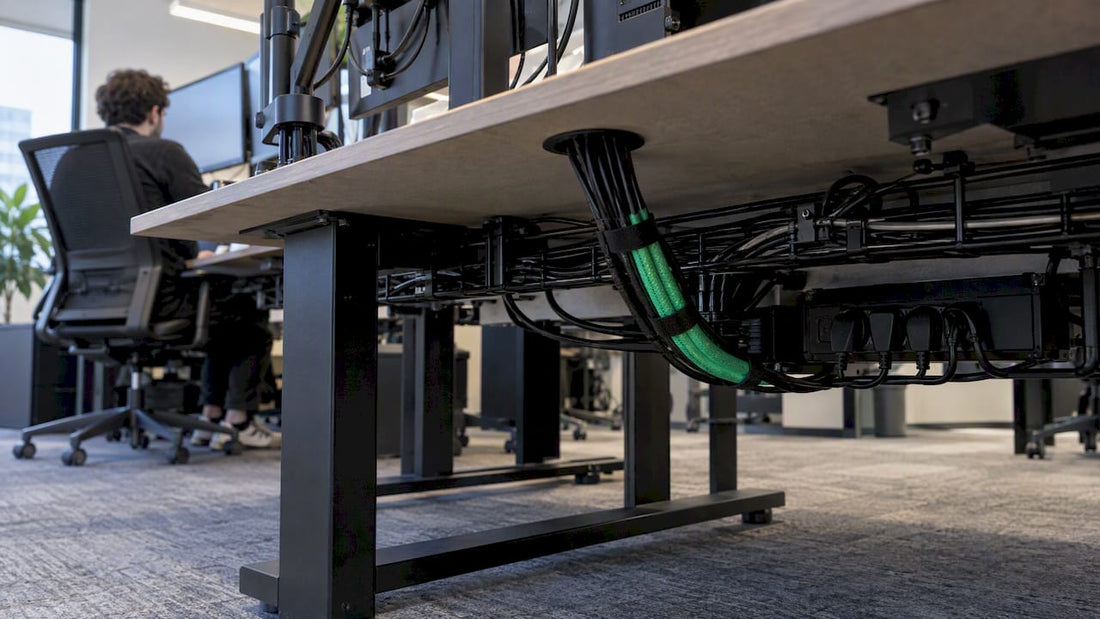 Organized cables routed beneath a trading desk